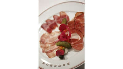 Charcuterie hors d’oeuvres with house-made pickled vegetables at Bouchon