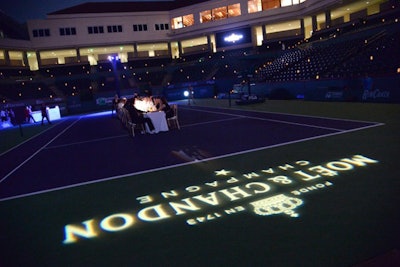 A logo gobo announced the name of the host, and about 1,000 candles flickered on chairs around the stadium in an effort to make it feel more intimate.