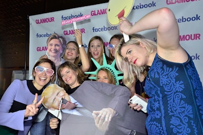 Guests posed for photos with cutouts of the presidential candidates and political props.