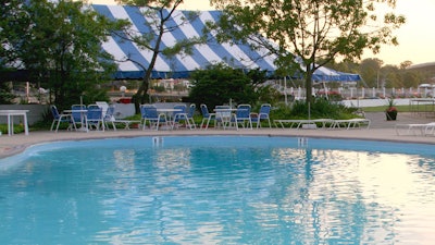 The pool at Mamaroneck Beach and Yacht Club is flanked by a waterfront cafe.