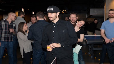 SPiN’s chief artistic director Mathieu Forget observes a game of ping pong.