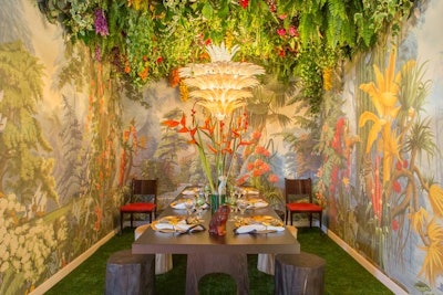 De Gournay’s Le Eden wallpaper served as the backdrop for Luxe Interiors & Design magazine's tablescape, which was designed by Sasha Bikoff. The rainforest-like setting featured woodwork from Liaigre, an abundant floral overhang, and tree trunk stools.