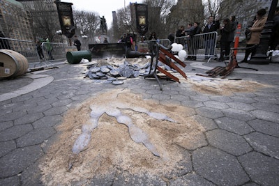 The dragon landing site appeared in New York's Union Square on March 15, and was designed to inform fans of a screening event for the season five release, which took place later in the evening. The low-tech activation had props including toppled trash cans, broken benches, and fake smoke.