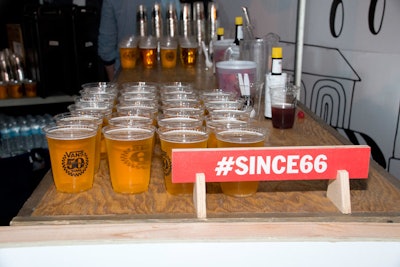 Guests also sipped beer in branded anniversary cups. The hashtag #since66, alluding to Vans' founding year, appeared on display signage.