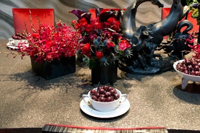 As an homage to The New York Times, designer Darrin Varden, along with Lladró, interpreted the phrase “black and white and read all over” for the newspaper's vignette with matte-black horse figurines and bold red florals.