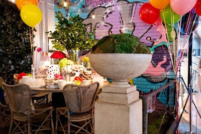 To celebrate the New York Design Center’s 90th year, Antonino Buzzetta created a festive rooftop party setting complete with graffiti-covered walls, colorful balloons, and an abundance of goodies stacked high on the tables.