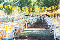 Bunting hung over 170 tables for 700 guests in the V.I.P. picnic space within the Veuve Clicquot Polo Classic in Los Angeles in 2013.