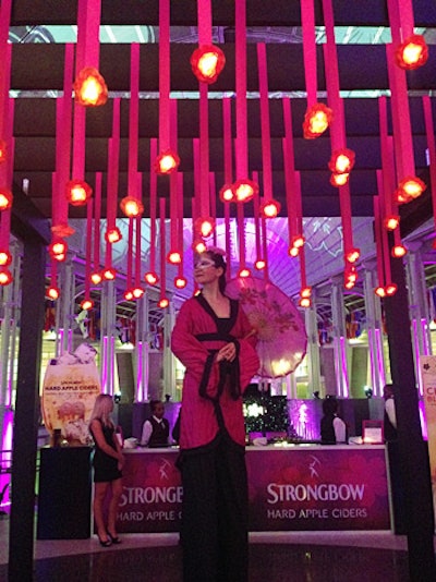 A Japanese stilt walker posted for photos with guests in the upper oculus bar.