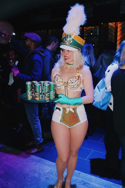Costumed cabaret performers from the Love Show handed out cans of Perrier as well as danced from the catwalk and main dance floor.