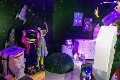 The installation had four photo stations including one where children could wear astronaut gear.