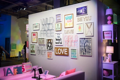 A lounge space in the middle of the installation had a feature wall full of wall hangings with inspirational phrases.