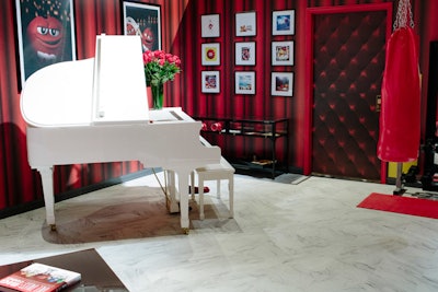 Inspired by the personality of the original M&M's 'Spokescandy,' the red room featured nostalgic touches including a Hardman, Peck & Company piano.