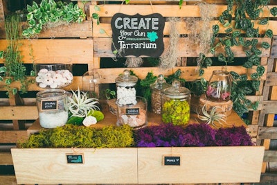 Seed Floral Interactive’s terrarium bar can be customized by including trinkets and colors to reflect the theme of an event or a company’s logo.