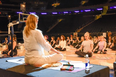 The event began with a yoga session on the court lead by supermodel and yogi Angela Lindvall.