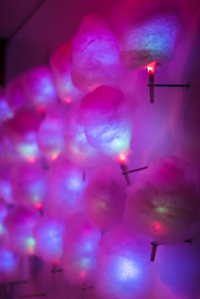 Magnolia Bluebird Design & Events created walls of cotton candy served on LED glow sticks for a Pop Art-theme sweet sixteen party, held at the Musikfest Café at the SteelStacks in Bethlehem, Pennsylvania in January 2015. “It smelled like a Katy Perry concert when you walked in the door,” said Danielle Couick, principal of the Columbia, Maryland-based event planning company.