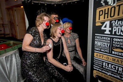 An after-party featured a photo booth with props such as clown noses.