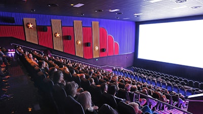 Guests get ready to enjoy a blockbuster film in a private auditorium.
