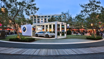 A BMW pop up display at night at the Americana at Brand