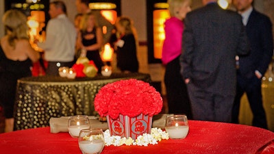 Use the theater’s lobbies and hallways to set up highboy tables and catering.