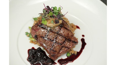Filet mignon with foie gras butter, cherry balsamic reduction, and spring pea and asparagus farro risotto