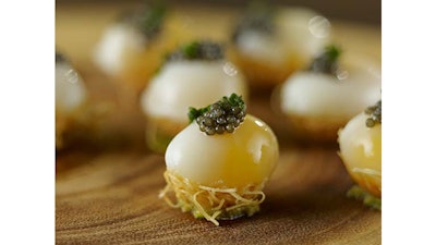 Quail egg and micro arugula with caviar.