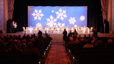 The curtain rises as you invite guests on stage for an elegant reception.