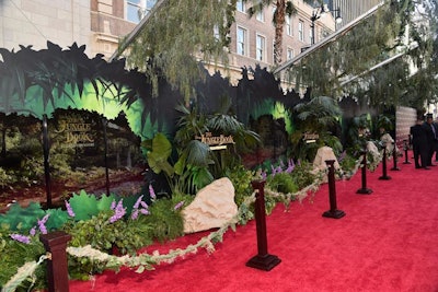 Instead of traditional velvet ropes, jungle-like vines connected to stanchions.