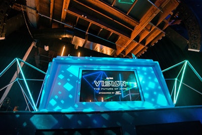 The Trondeliers flanked the DJ booth, which also had the 'Vision' logo. The event featured two dueling DJs.