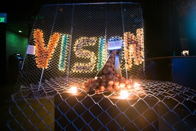 The event's theme was 'Vision.' The word was spelled out in an installation made with cups of popcorn. From the 'O' in vision, doughnut holes poured forth in a setup referred to as 'Orbs in the Abyss.'