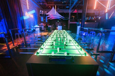 Guests played foosball at a table that glowed with LED lights.