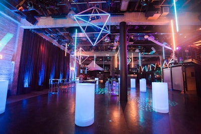 To match the futuristic theme, Got Light brought in their 'Trondeliers,' or illuminated geometric fixtures. When event planner Caryl Lyons saw the fixtures, 'I knew we had to hang them from the ceiling,' she said.