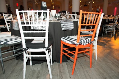 Dotting the dining room were chairs in bright orange and hot pink, adding a pop of color to the neutral design.