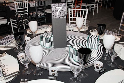 The black-and-white theme featured playful yet subtle details like dominos and playing cards as table decor.