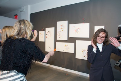 Guests attempted to score during a round of artsy darts by Davide Balula during the Public Art Fund's spring benefit.