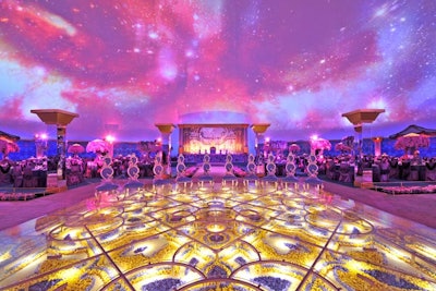 For a private event, Preston Bailey designed a carpet-like installation filled with hundreds of purple and golden blooms, covered with Plexiglas.