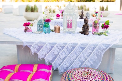 Adrienne Bosh, who is married to Miami Heat player Chris Bosh, hosted a motivational event known as “Glamchella” last summer in Miami. At the affair, bohemian-inspired decor included textured table linens, Buddha sculptures, lanterns, and jewel-toned cushions for seating.