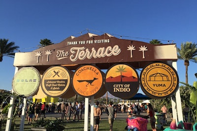 The Terrace dining area on the festival grounds was marked by banners resembling maps or street signs.