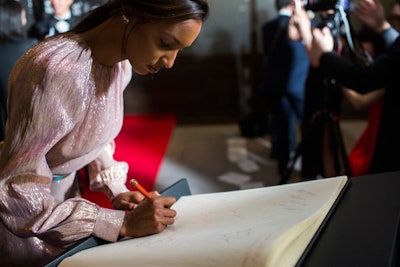 As is the tradition at all global Montblanc events, a large Montblanc journal was displayed on an easel adjacent to the step-and-repeat during cocktails for guests to sign and send wishes to the brand. It also served as an organic photo op to capture V.I.P.s using Montblanc writing instruments.