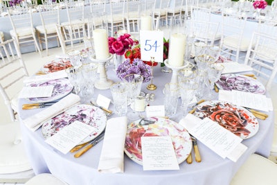 Seven different types of flowers—including peonies, anemones, and ranunculus, all of which were flown 2,500 miles from Columbia to New York—were used in the centerpiece arrangements. White-washed cherrywood reception chairs featured beige linen cushions.