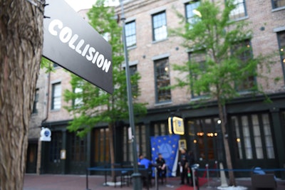 Organizers mounted signs outside each of the venues participating in Collision's opening night pub crawl to help participants find their way.