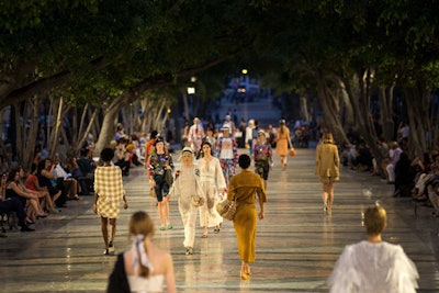 Chanel's May 3 'Coco Cuba' show took place on the Paseo del Prado, Havana’s main thoroughfarem which also serves as a symbol of the links uniting Cuba and France thanks to a redesign in 1928 by a French landscape architect, who placed eight bronze statues of lions—one of Coco Chanel’s beloved emblems of strength—at each of the crossroads. The audience took in the open-air show seated on park benches.