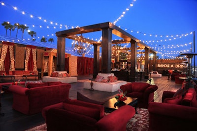 String lights hung over the alfresco cocktail space with lounge-style seating on the waterfront.