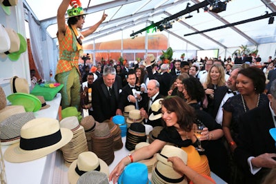 Guests picked up Panama-style hats from a colorful bar to wear during dinner.