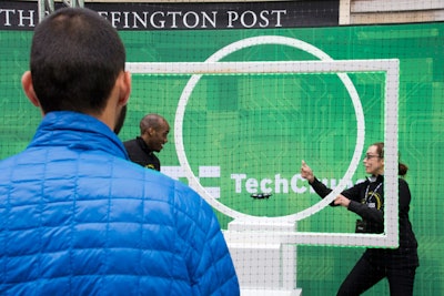Guests learned how to maneuver drones through a netted obstacle course with TechCrunch editors.