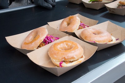 Pulled pork topped with slaw and served on glazed doughnuts was one of the many fair-style menu options, provided by Creative Edge Parties, at the outdoor event.