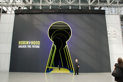 Guests entered the benefit by walking through an oversize keyhole, a visualization of the evening's theme of 'Unlock the Future.' Freestanding keyholes in the same size continued at intervals along the entryway.