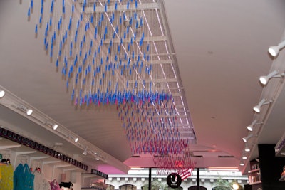 A clever ceiling installation featuring dangling tampons hung from the center of the space.