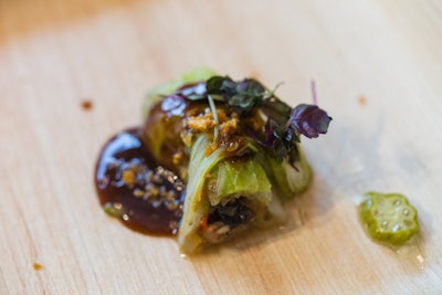 Chef Erik Bruner-Yang of Maketto in Washington served a jing roll, one of his signature bites. The dish contains ingredients such as cabbage leaves, black mushrooms, potato puree, and pickled okra.
