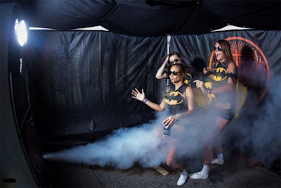 The “Shot in the Dark” photo booth hits guests with a loud, cold blast of carbon dioxide as they enter the room to evoke a surprising reaction for their first photo.