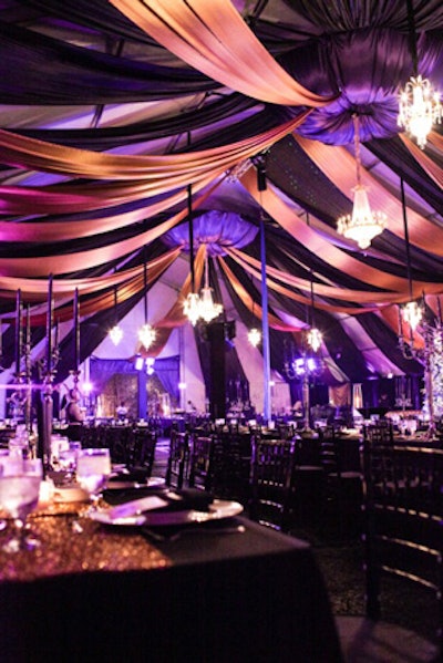 For a 2012 holiday party for CyberCoders in Newport Beach, California, 10 crystal chandeliers decorated a heavily draped ceiling in a space done in black, gold, and purple.